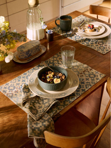 Place setting of dishes on table