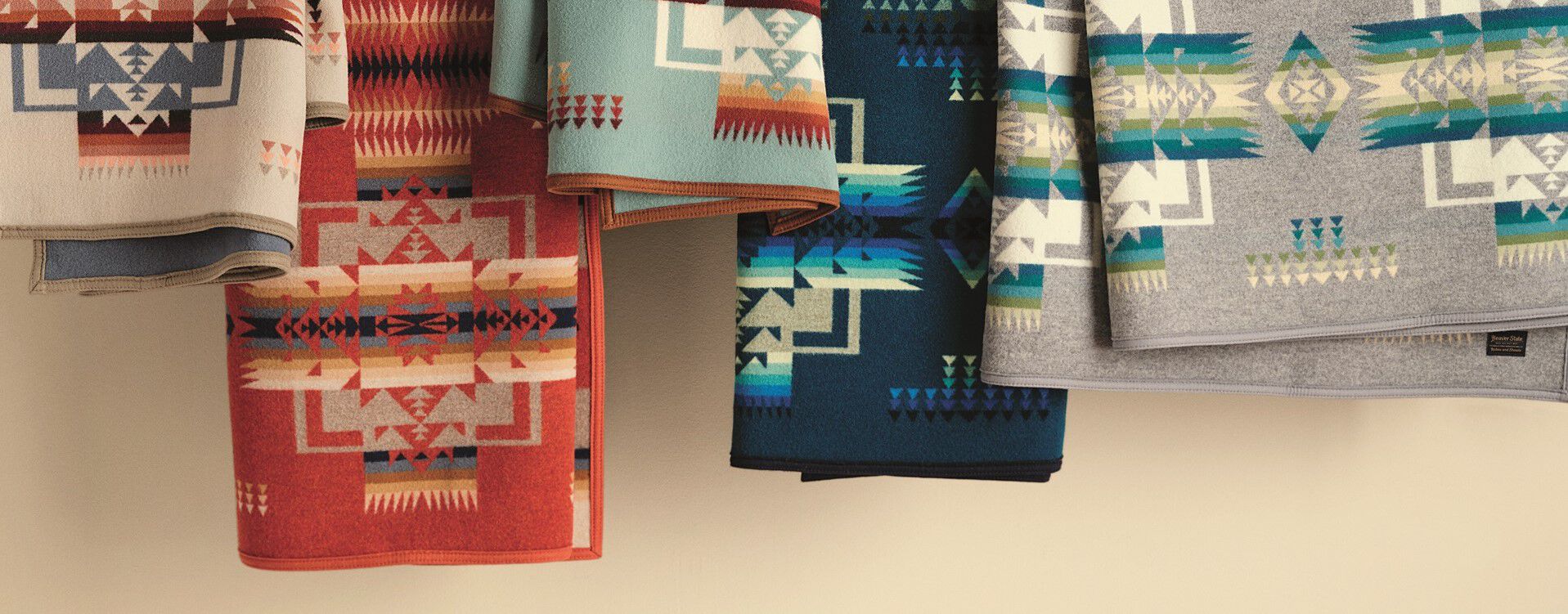 Colorful Chief Joseph Blankets hanging on a bar