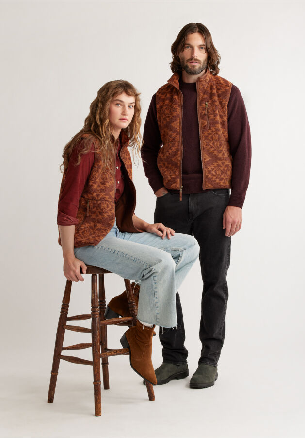Man and Women in Matching $99 Fleece Vests