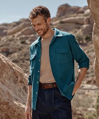 Man standing outside wearing a Pendleton Board Shirt