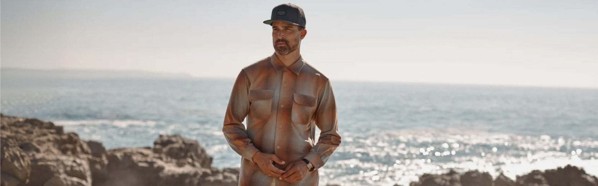 Man on the beach wearing a Pendleton Board Shirt