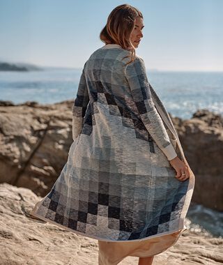 Woman on the beach wearing a Pendleton Sweater