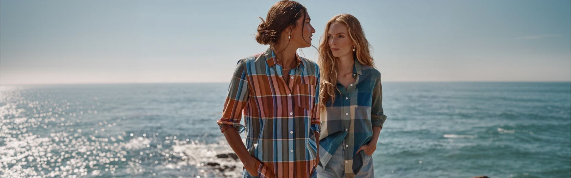 Women walking on the beach in Pedleton Plaid Shirts