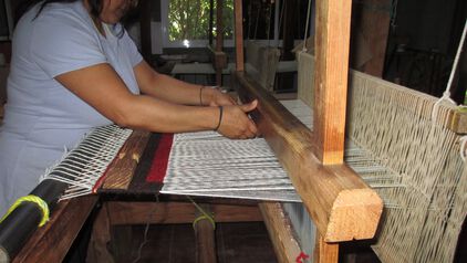 Man weaving the Espanola Dazzler Rug