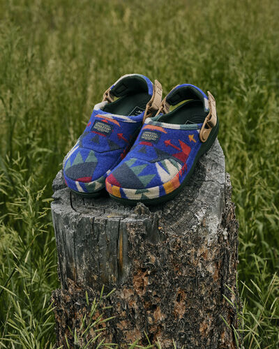 Pair of Crocs x Pendleton outside in a field