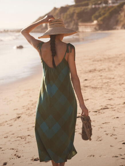 Woman in Dress Walking on the Beach