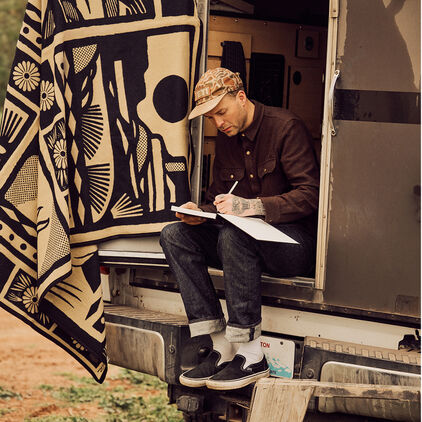 Artist Jess Mudgett sketching outdoors