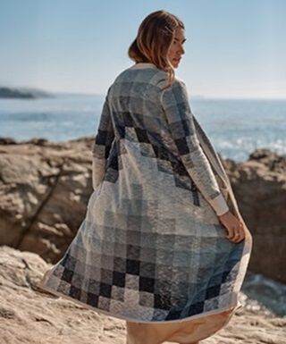 Woman outside on the beach wearing a Pendleton Duster Cardigan