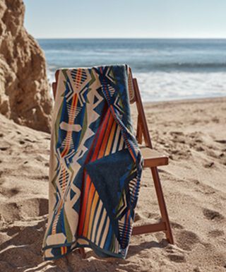 Pendleton towels outside on a beach chair