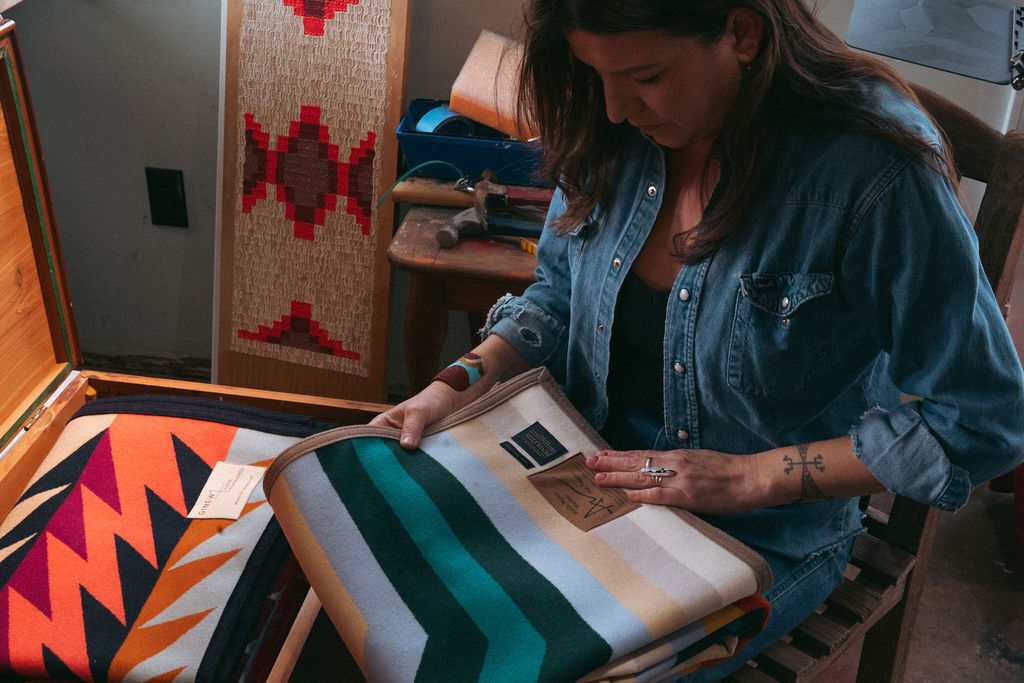 Addie Roanhorse Looking at the Middle Waters Blanket