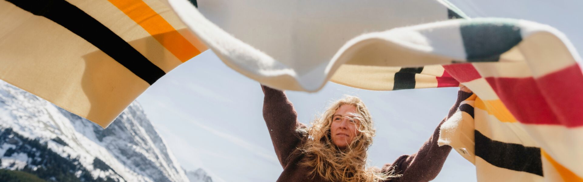 Woman in Glacier National Park with Pendleton Glacier Blanket
